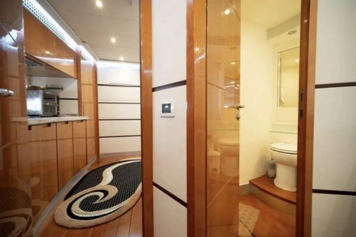Slide: The Image of Luxurious interior of 2007 Pershing 62' yacht featuring modern kitchen and bathroom design. - 11
