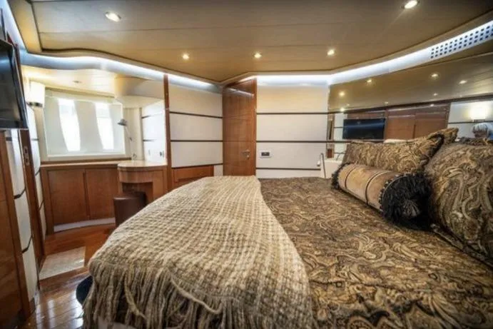 Slide: The Image of Luxurious bedroom interior of 2007 Pershing 62' yacht with elegant decor and ambient lighting. - 3