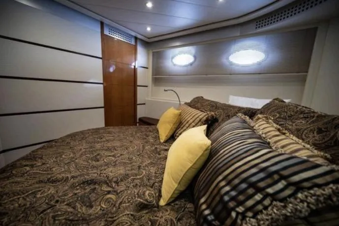 Slide: The Image of Luxurious bedroom interior of 2007 Pershing 62' yacht with elegant bedding and ambient lighting. - 5