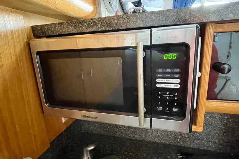 Slide: The Image of Emerson microwave in 1989 Silverton 34 Convertible boat kitchen. - 14
