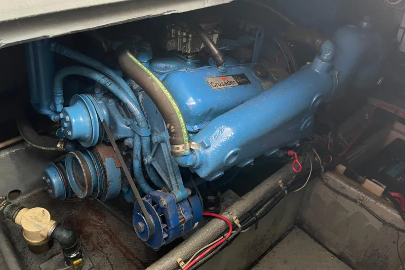 Slide: The Image of 1989 Silverton 34 Convertible engine compartment with blue Crusader engine. - 19