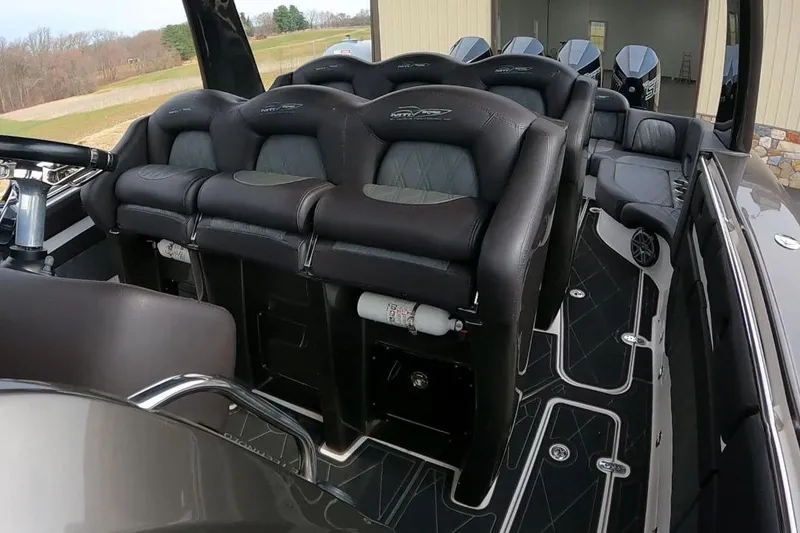 Slide: The Image of Luxury MTI V42 boat interior with plush seating, sleek design, and modern features, 2018 model. - 12