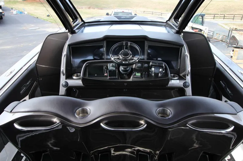 Slide: The Image of Cockpit of 2018 MTI V42 boat with modern steering and controls. - 13