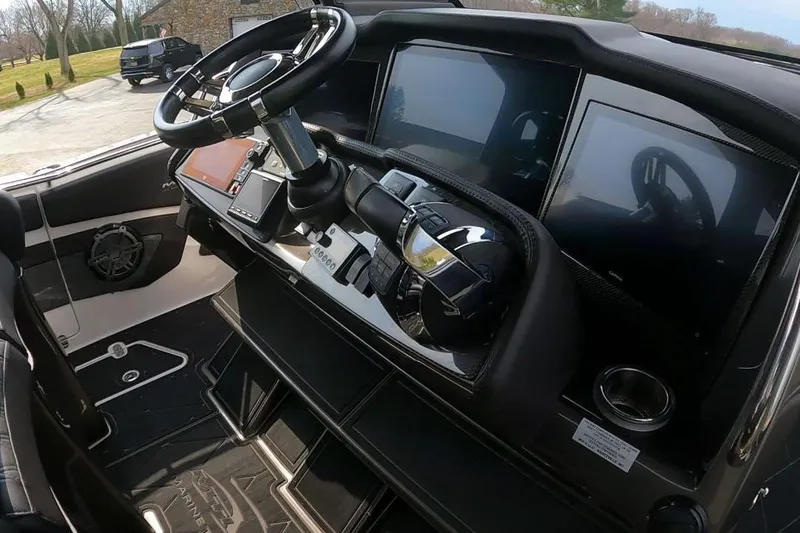 Slide: The Image of Cockpit of 2018 MTI V42 boat with modern steering and digital displays. - 14