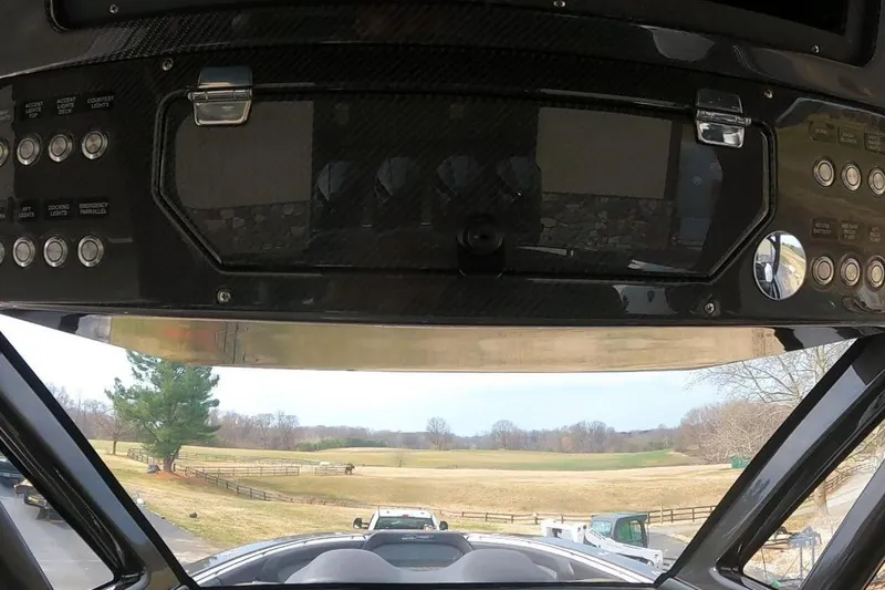 Slide: The Image of Control panel of 2018 MTI V42 boat with scenic countryside view. - 16