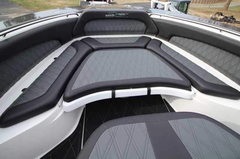 Slide: The Image of Luxurious seating area on a 2018 MTI V42 boat with diamond-stitched upholstery. - 18