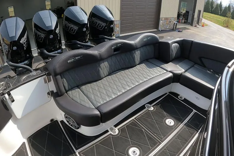 Slide: The Image of Luxurious 2018 MTI V42 boat interior with plush seating and powerful outboard engines. - 26