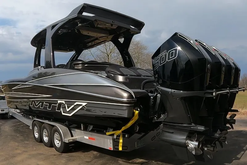 Slide: The Image of 2018 MTI V42 boat with triple outboard engines on a trailer. - 3