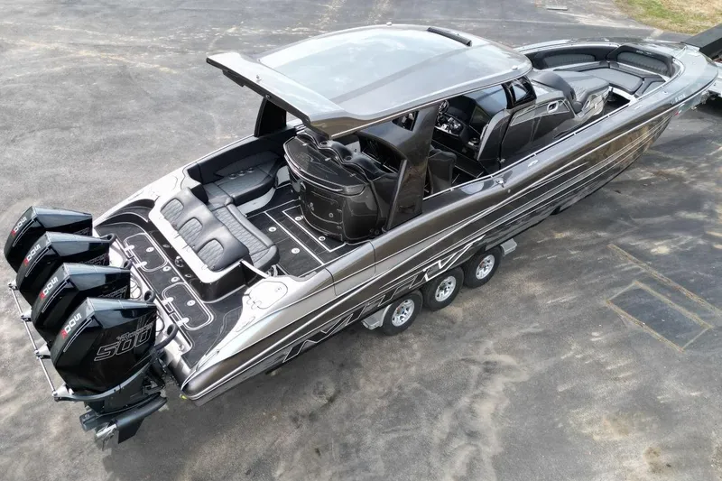 Slide: The Image of 2018 MTI V42 boat with quad engines, sleek design, and spacious seating. - 7