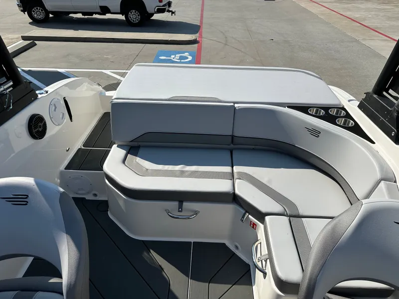 Slide: The Image of Interior of 2026 Bayliner V20i with gray upholstered seating. - 12