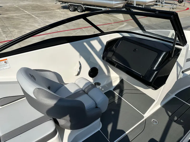 Slide: The Image of Interior of 2026 Bayliner V20i with gray seat and dashboard. - 14