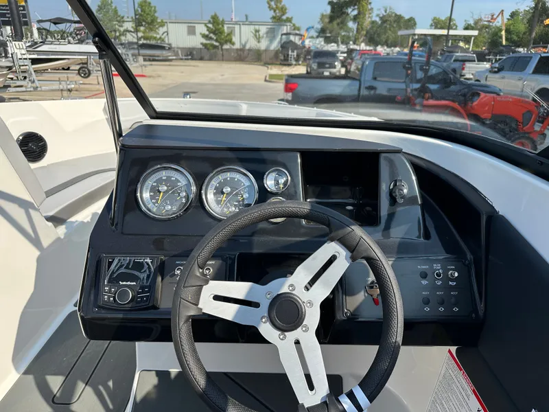 Slide: The Image of Dashboard of 2026 Bayliner V20i with steering wheel and gauges. - 17