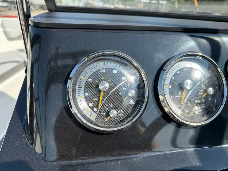Slide: The Image of Dashboard of Bayliner V20i 2026 with speedometers. - 18