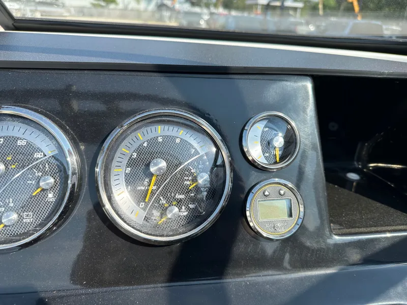 Slide: The Image of Dashboard of Bayliner V20i 2026 with gauges. - 19