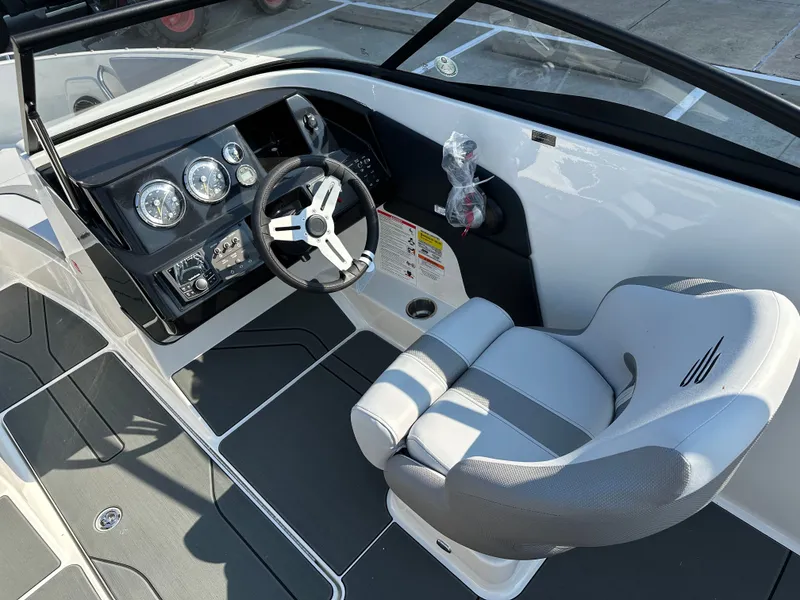 Slide: The Image of Interior of 2026 Bayliner V20i with steering console and seat. - 23