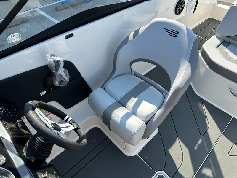 Slide: The Image of Interior of 2026 Bayliner V20i with steering wheel and seat. - 24