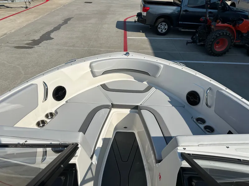 Slide: The Image of Interior view of 2026 Bayliner V20i with seating area and cup holders. - 25