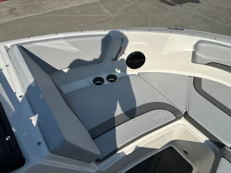 Slide: The Image of Interior of 2026 Bayliner V20i with seating area and cup holders. - 26