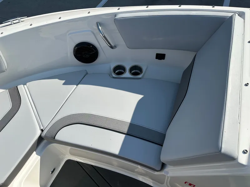 Slide: The Image of Interior of 2026 Bayliner V20i with seating area and cup holders. - 28
