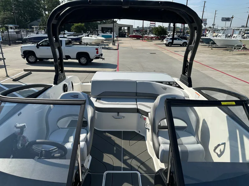 Slide: The Image of Interior view of 2026 Bayliner V20i boat on a parking lot. - 29