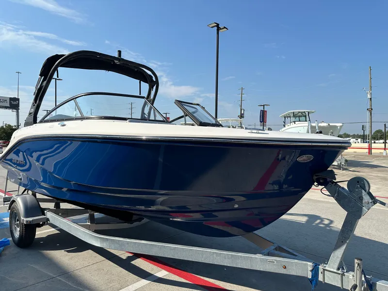 Slide: The Image of 2026 Bayliner V20i boat on trailer outdoors. - 5