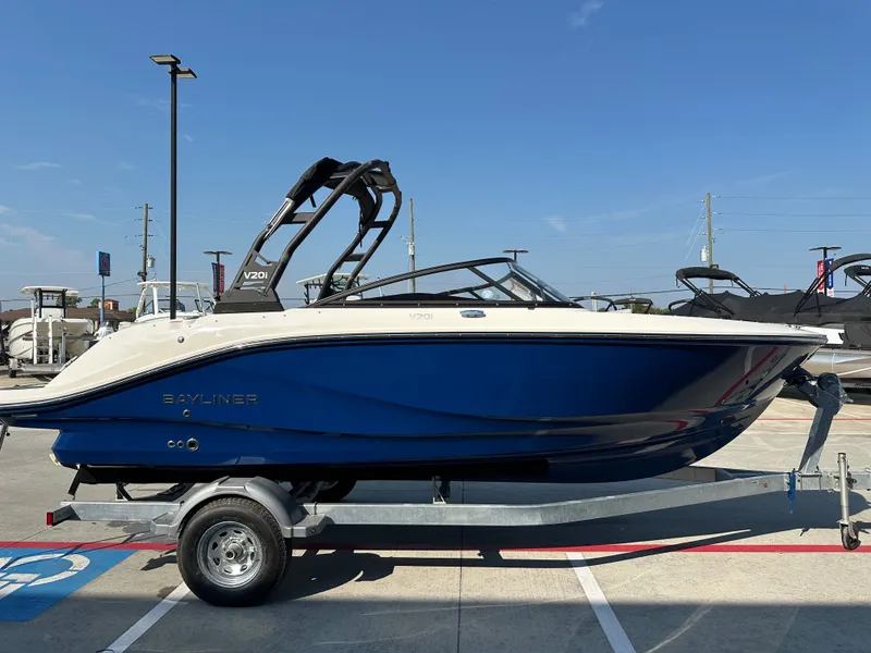 Slide: The Image of 2026 Bayliner V20i boat on trailer, blue hull, sunny day. - 6