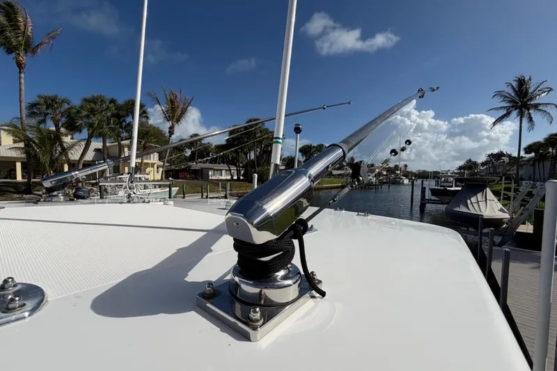 Slide: The Image of 2022 Bluewater 2850 CC boat with Garmin xHD2 radar, docked near palm trees. - 10