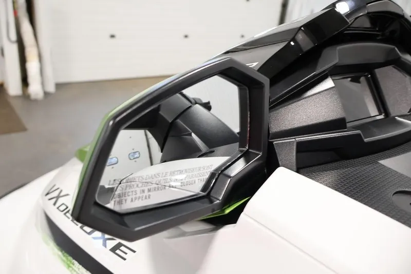 Slide: The Image of 2026 Yamaha WaveRunner VX Deluxe side mirror close-up in a showroom. - 14