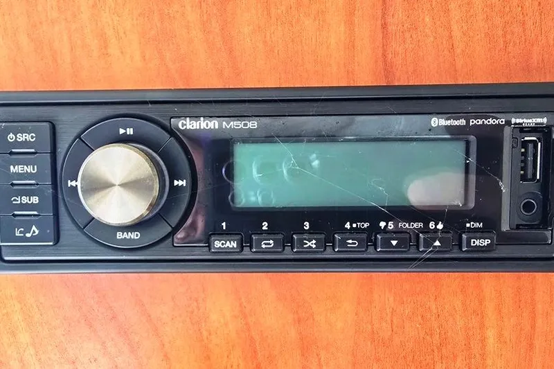 Slide: The Image of Clarion M508 stereo system on 2006 Rinker 246 Captiva Cuddy boat dashboard. - 12