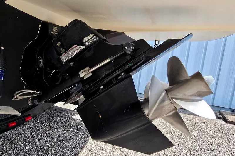Slide: The Image of 2006 Rinker 246 Captiva Cuddy boat propeller and outdrive close-up. - 20