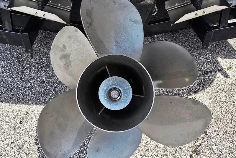 Slide: The Image of Propeller of a 2006 Rinker 246 Captiva Cuddy boat on a textured surface. - 22