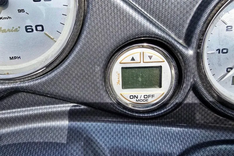Slide: The Image of Dashboard of 2006 Rinker 246 Captiva Cuddy with speedometer and digital display. - 26
