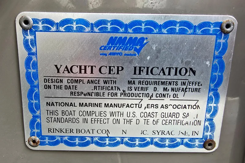 Slide: The Image of 2006 Rinker 246 Captiva Cuddy yacht certification plaque with compliance details. - 28