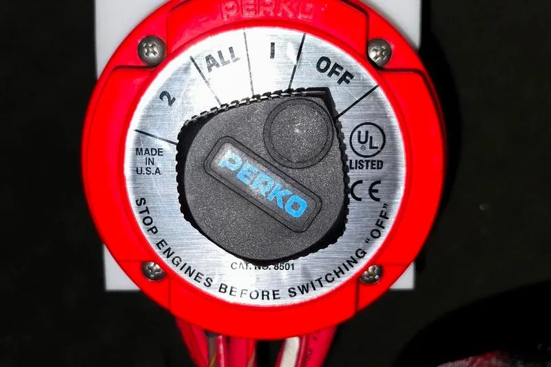 Slide: The Image of Red Perko battery switch on a 2006 Rinker 246 Captiva Cuddy boat. - 29