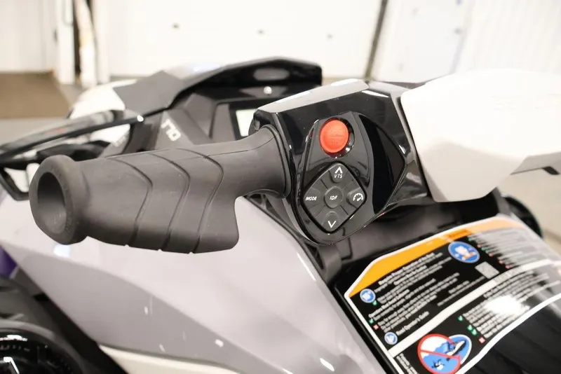 Slide: The Image of 2025 Sea-Doo GTI SE 170 handlebar controls with buttons and grip detail. - 11