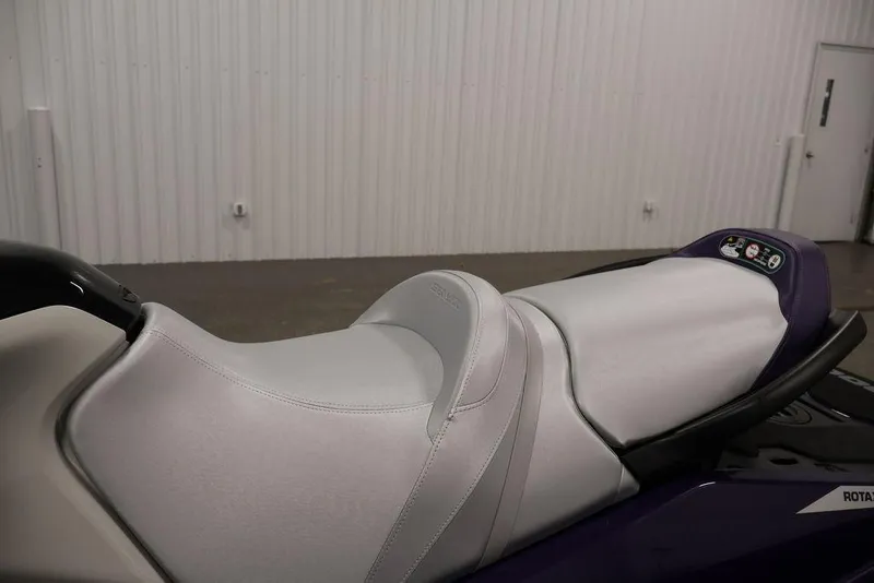 Slide: The Image of 2025 Sea-Doo GTI SE 170 jet ski seat, featuring ergonomic design in a showroom. - 14