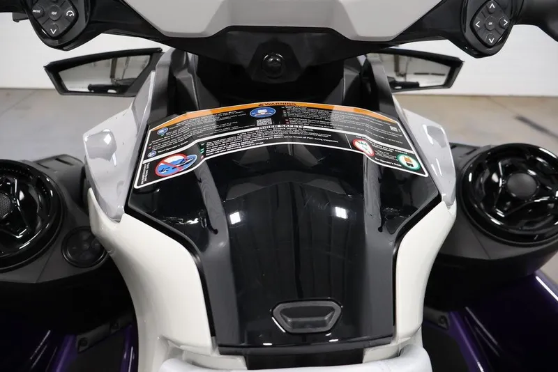 Slide: The Image of 2025 Sea-Doo GTI SE 170 dashboard with controls and warning labels. - 15