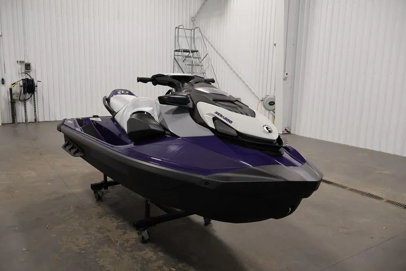 Slide: The Image of 2025 Sea-Doo GTI SE 170 jet ski in a garage, featuring a sleek purple design. - 2