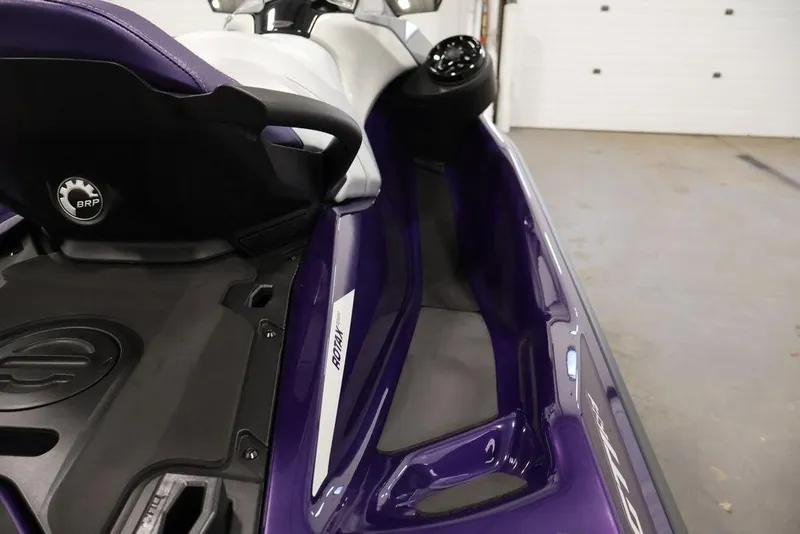 Slide: The Image of 2025 Sea-Doo GTI SE 170 jet ski, purple and black, interior view. - 21