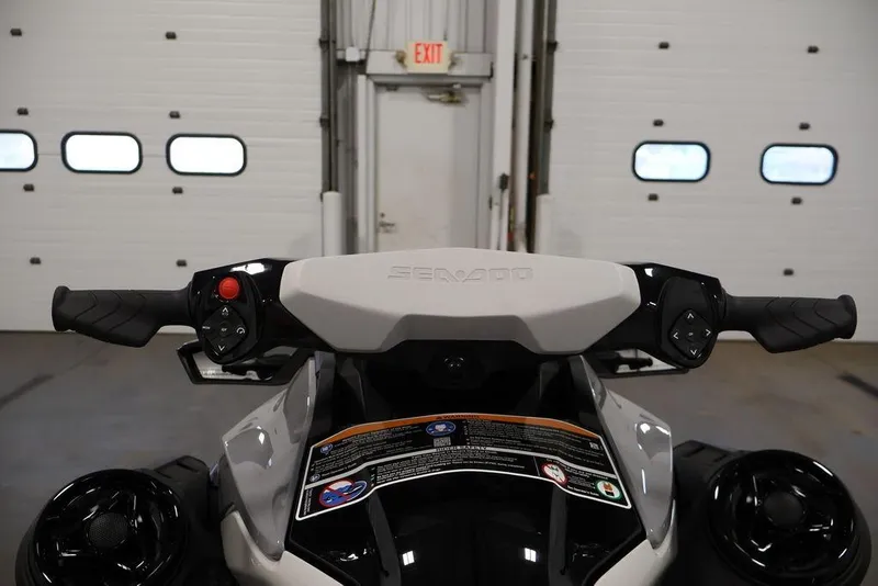 Slide: The Image of 2025 Sea-Doo GTI SE 170 handlebars in a garage setting. - 3