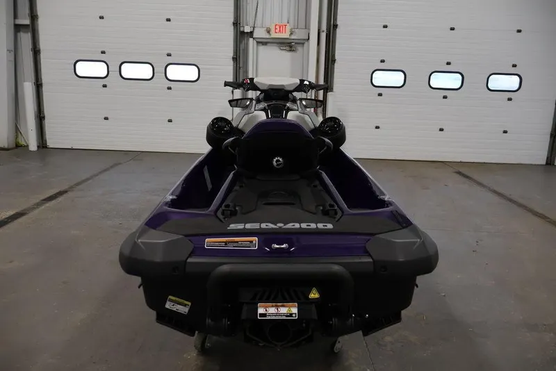 Slide: The Image of 2025 Sea-Doo GTI SE 170 jet ski in a garage, rear view. - 5