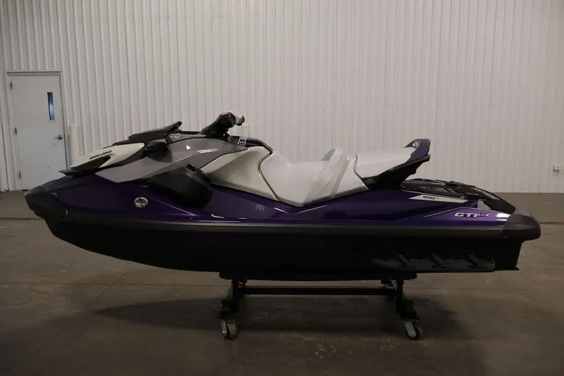 Slide: The Image of 2025 Sea-Doo GTI SE 170 jet ski in a showroom, side view. - 7