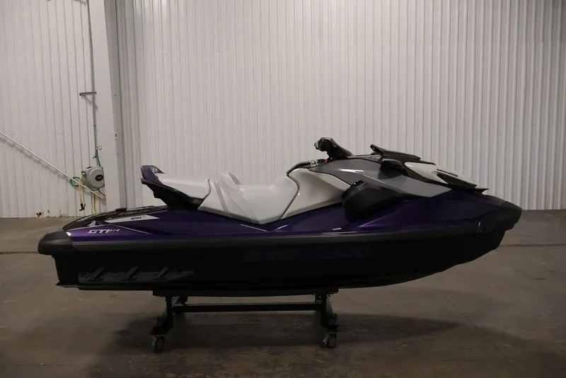 Slide: The Image of 2025 Sea-Doo GTI SE 170 jet ski in a garage, side view. - 8