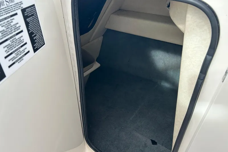 Slide: The Image of Interior cabin of a 2010 Sea Ray 260 Sundeck boat, showing storage space. - 10