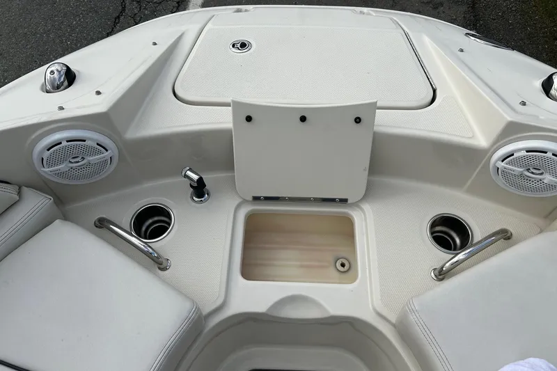 Slide: The Image of 2010 Sea Ray 260 Sundeck boat interior with speakers and cup holders. - 14