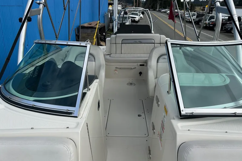 Slide: The Image of 2010 Sea Ray 260 Sundeck boat interior with seating and windshield. - 17