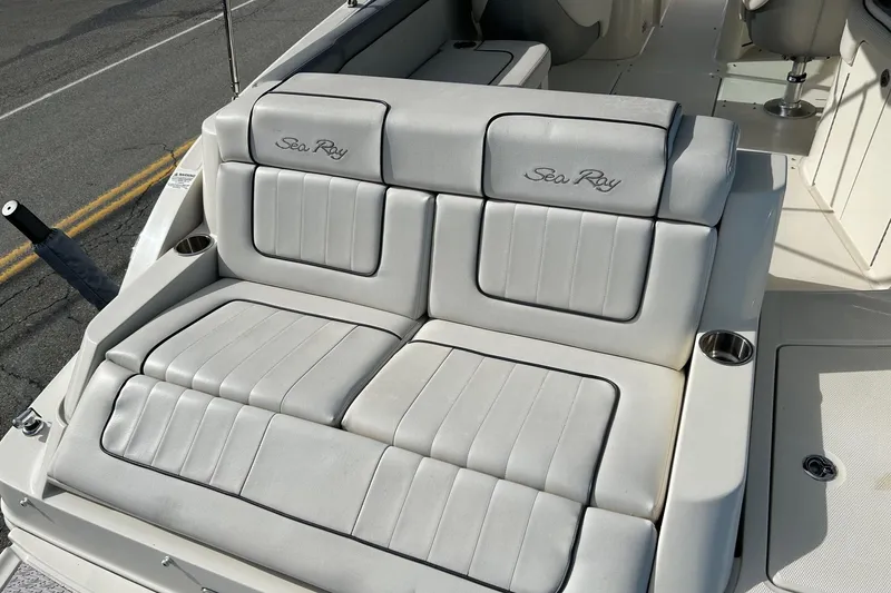 Slide: The Image of 2010 Sea Ray 260 Sundeck boat with plush seating and cup holders. - 25