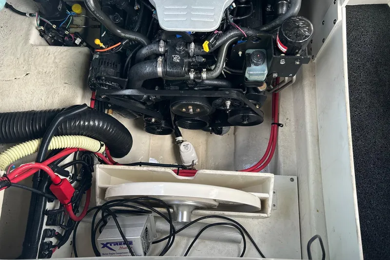 Slide: The Image of Engine compartment of a 2010 Sea Ray 260 Sundeck boat, showing mechanical components. - 29
