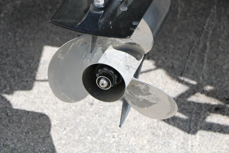 Slide: The Image of Propeller of 2012 Starcraft Stardeck 206 4-PT boat on pavement background. - 13