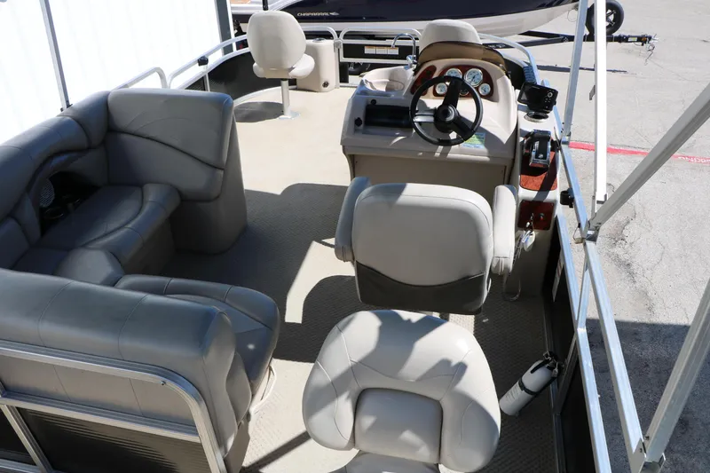 Slide: The Image of 2012 Starcraft Stardeck 206 4-PT pontoon boat interior with seating and steering console. - 20